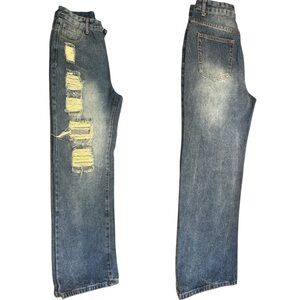 Women's high-waisted, wide-leg ripped jeans in a medium to light wash